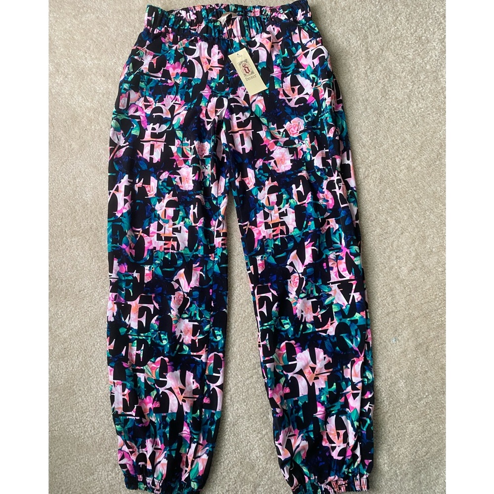 womens small power pants with elastic waist and elastic ankle. Brand new unworn